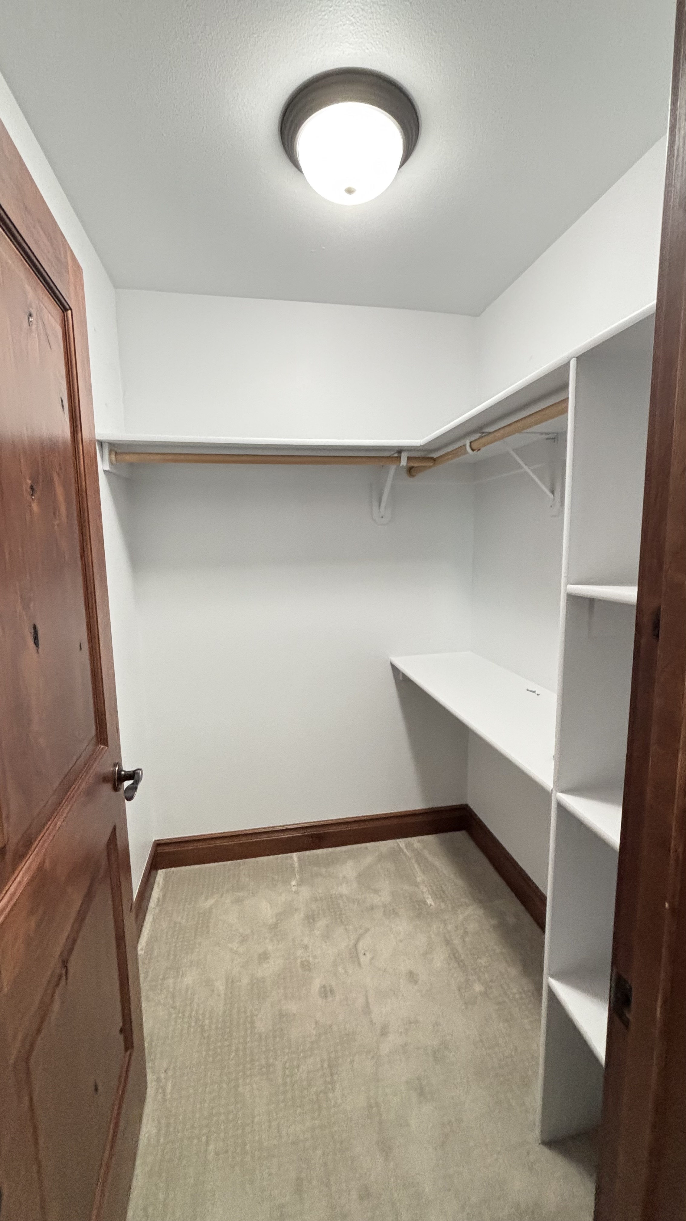 The original closet before the build — cramped and overflowing